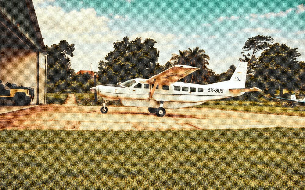 Asante Aviation's first Grand Caravan, 5X-SUS, parked by the hangar